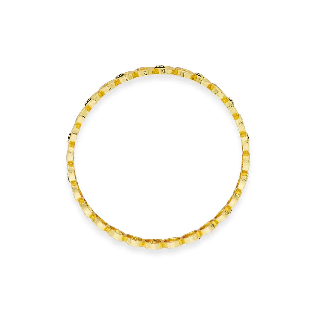 Gold bangle on a white background