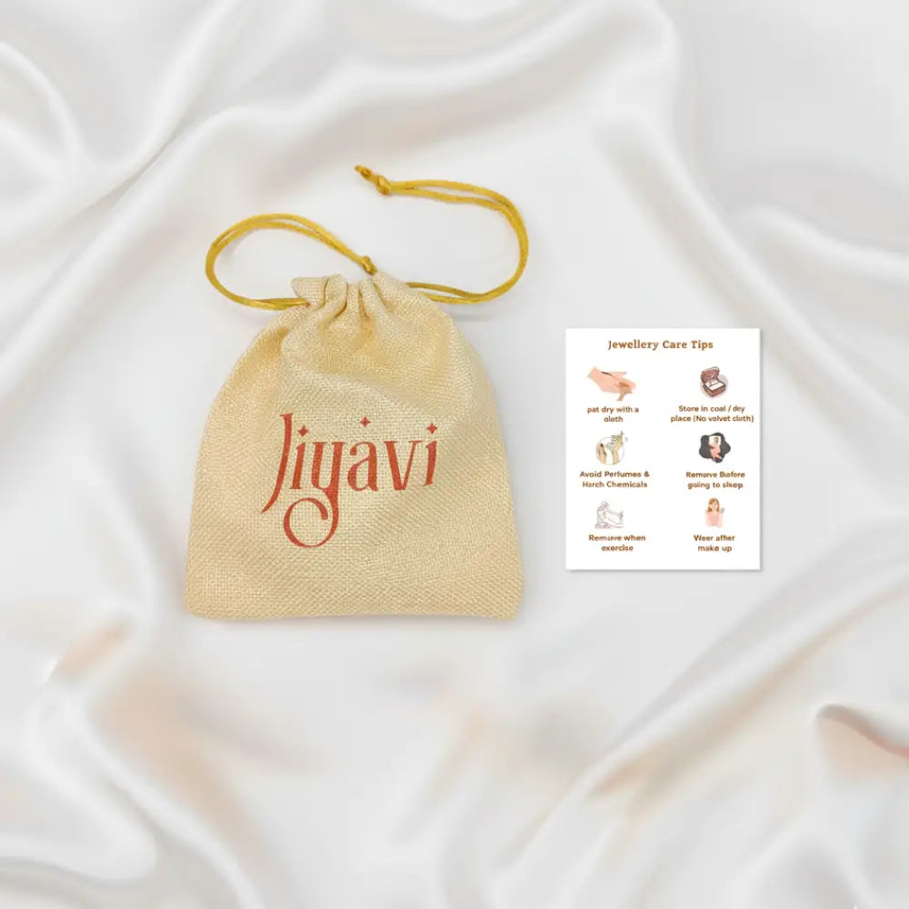 Jiyavi's jute potli bag Packaging and care instruction card on satin