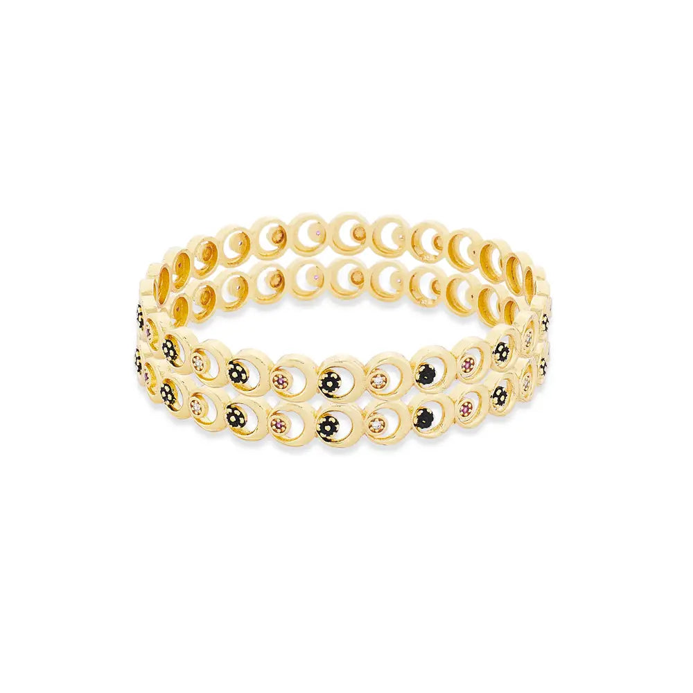 Gold Bangles with circular design on a white background