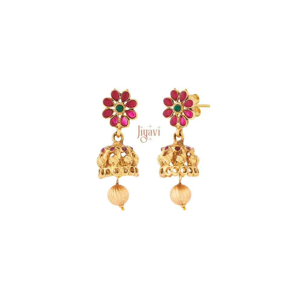 Gold earrings with floral design and red stones on a white background, branded 'Jiyavi'.