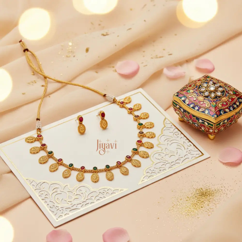 Jewelry set with necklace and earrings on a decorative card, featuring the brand 'Jiyavi'.