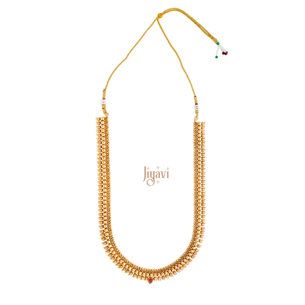 Gold necklace with red accents on a white background, featuring the brand 'Jiyavi'.