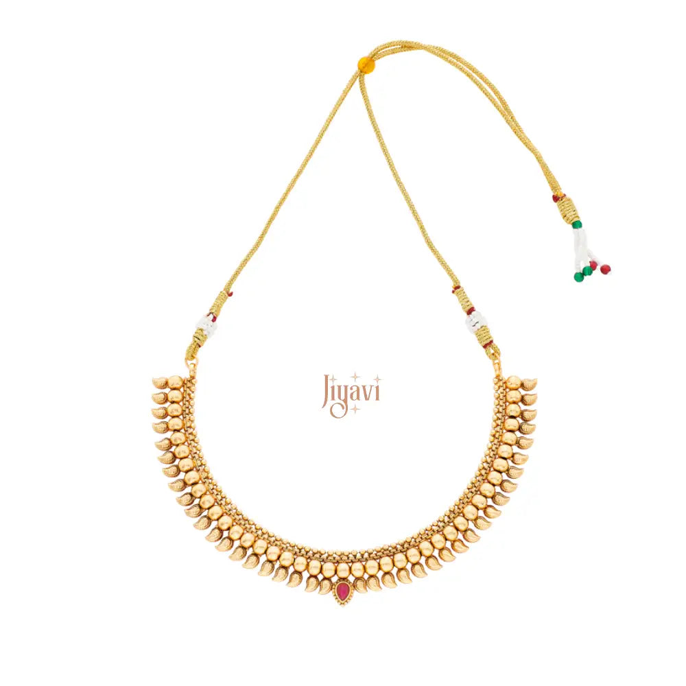Gold necklace with red gemstone on a white background, featuring the brand 'Jiyavi'.