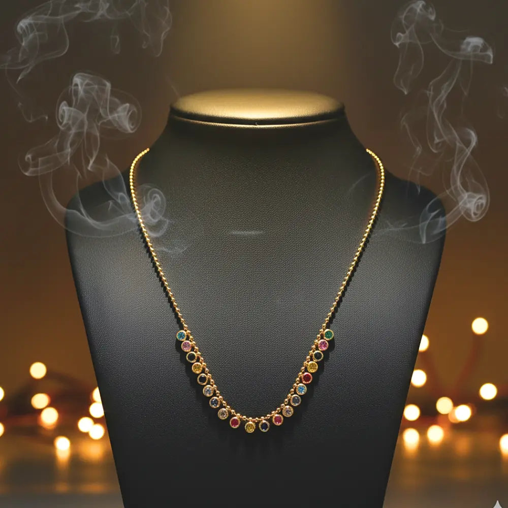 Multicolored beaded necklace on a black mannequin with a warm, blurred background
