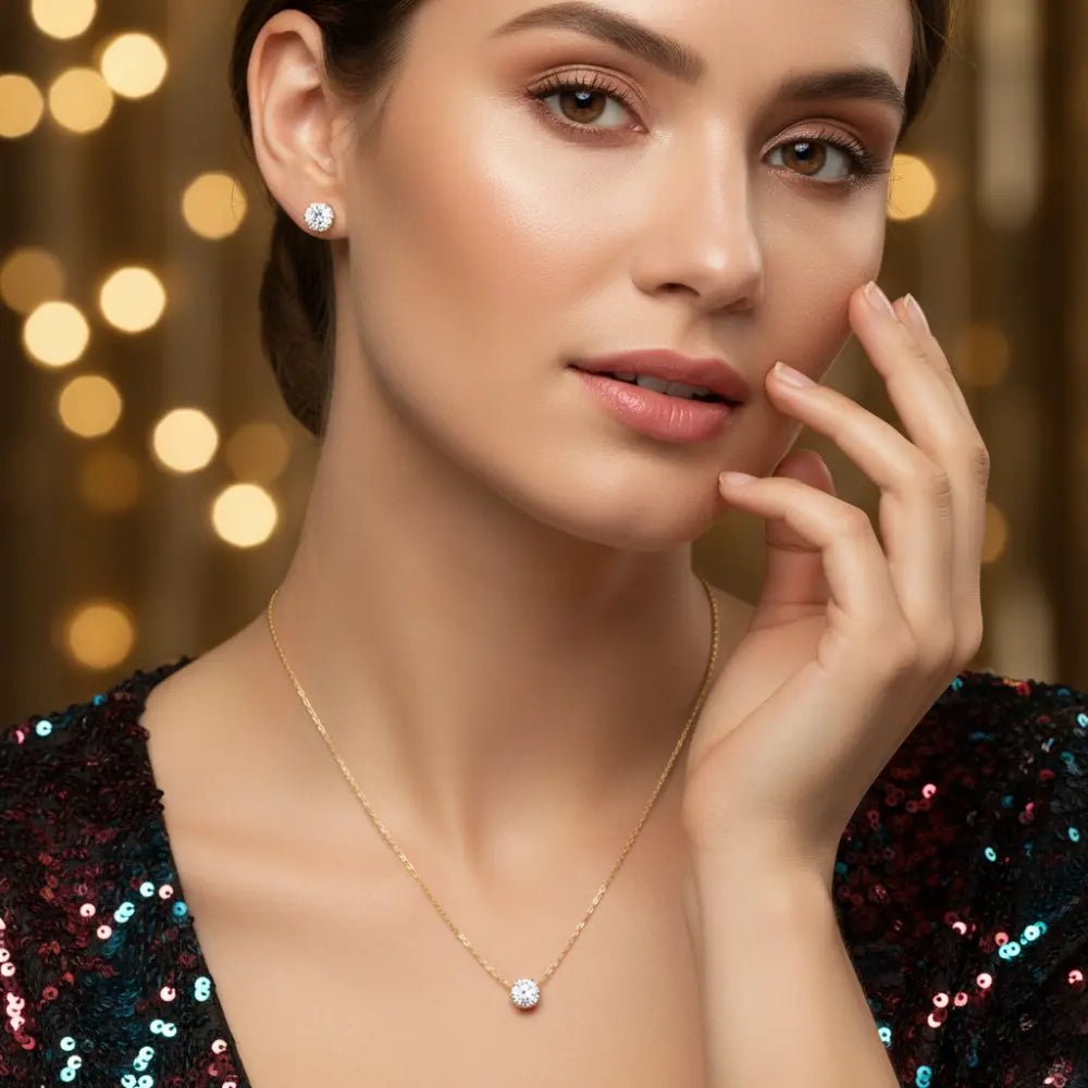 Woman wearing a gold necklace with a blurred bokeh background