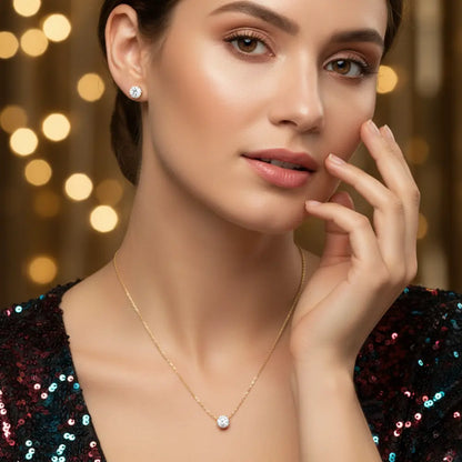 Woman wearing a gold necklace with a blurred bokeh background
